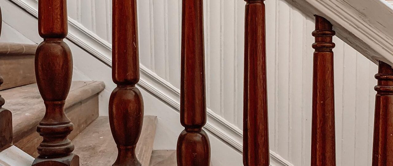 Restored Victorian wood balusters and treads on the grand staircase inside the 1889 Oaklands on 9th brownstone in downtown Minneapolis.