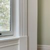 Restored 1889 painted window trim and woodwork inside a furnished studio at Oaklands on 9th