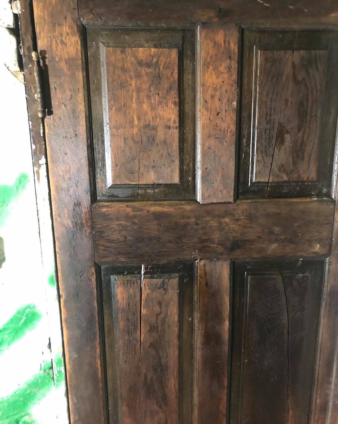 The only surviving original 1889 door at Oaklands on 9th, restored and rehung at the old coal room, now the electrical room
